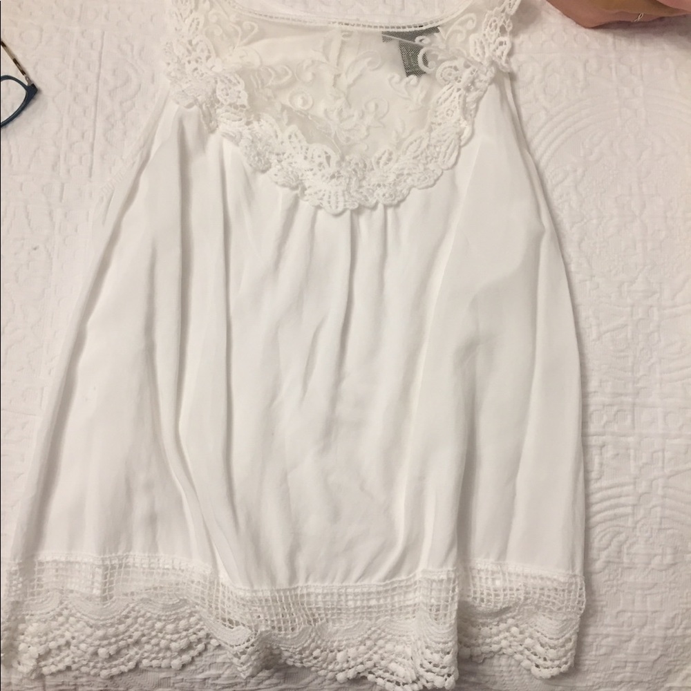 white tank top with lace at the top and bottom